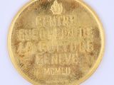 a gold coin with a picture of a man on it
