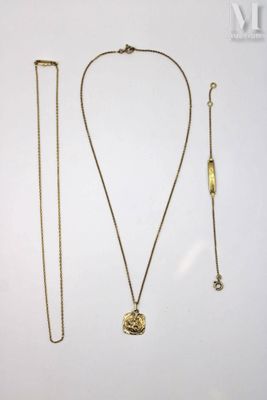 a close up of a necklace and two other items on a table