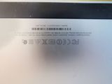 the back of a laptop with a bar code on it