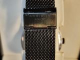 a close up of a watch in a box on a table