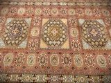 an image of a large oriental rug on a wooden floor