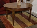 a table with a vase on top of it in a living room