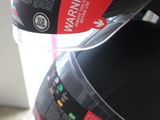 two black and red coffee mugs hanging on a rack