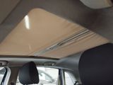 a view of the inside of a car from the driver ' s seat