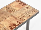 a table that has a tile design on it