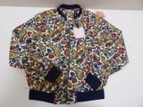 a white jacket with a blue and red floral pattern on it