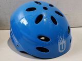 a blue helmet with holes on it sitting on a counter