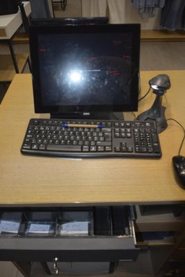 a computer on a desk with a keyboard and mouse