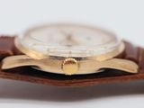 an image of a close up of a watch on a white surface
