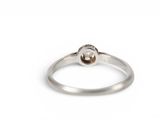a close up of a ring on a white background