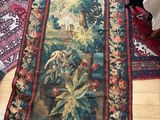 a long rug on the floor with a cat on it