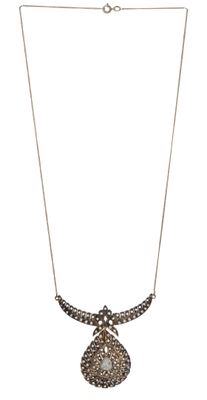 a close up of a necklace on a white background