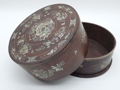 a brown box with a floral design on it