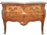 a wooden chest of drawers with a marble top
