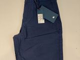 a pair of blue pants with a tag on the side