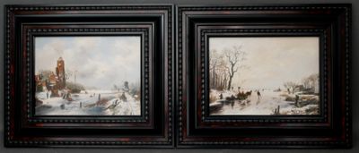 two framed paintings of a winter scene with a church in the background