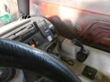 a close up of a steering wheel and dashboard of a truck