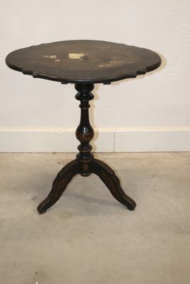 an image of a small table with a black top