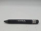 a close up of a pen on a white surface with a gray background