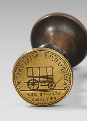 timbre en laiton plaqué, sur lequel figure l'image d'un chariot