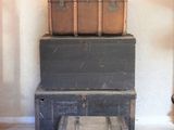 three trunks stacked on top of each other in a room