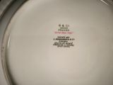 a white plate with a black writing on it