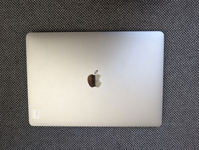 an apple macbook pro laptop sitting on top of a table