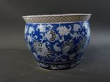 a blue and white vase sitting on a table