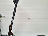 a scooter that is parked in front of a garage door