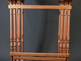 a small wooden table with a shelf on top of it