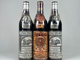 three bottles of beer sitting next to each other on a table