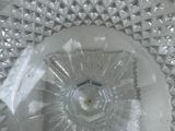 a clear glass plate with a decorative design on it