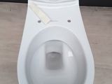 a white toilet with a piece of paper sticking out of it ' s tank