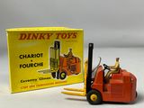 a toy forklift truck with a box on the back