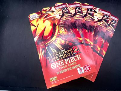 three packs of pokemon trading cards on a black surface