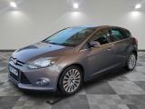 the ford focus is parked on a checkered floor in a garage