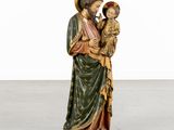 an image of a statue of a man holding a child