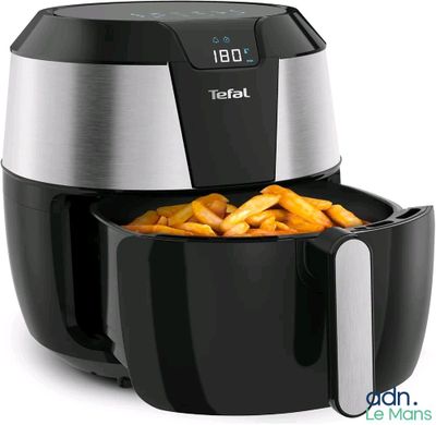 a close up of an air fryer with french fries in it
