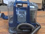 an image of a vacuum cleaner on a wooden table