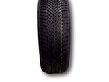 a close up of a tire on a white background