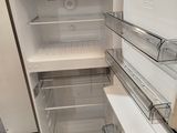 an open refrigerator that is sitting in a room