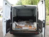 a white van that has a bunch of boxes in the back of it
