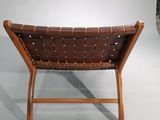 brown leather chair with wooden frame and foot rest on white background