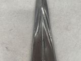 a close up of a pair of scissors on a white surface