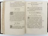 a book open on a white surface with a black border