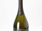 the bottle of champagne is sitting on the table ready to be served