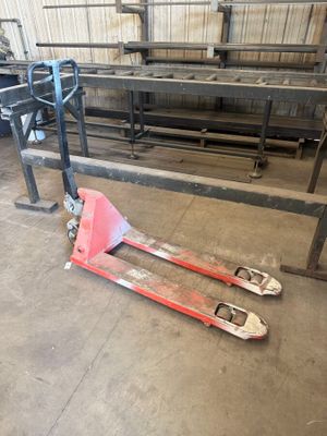 a picture of a fork lifter in a warehouse