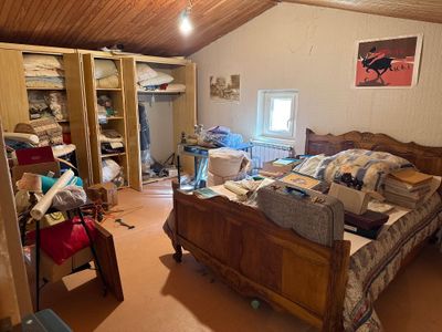 a bedroom with a bed and a closet in it