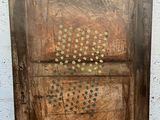 an image of a wooden box with holes in it on a sidewalk