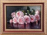 painting of pink roses in a gold frame on a black background